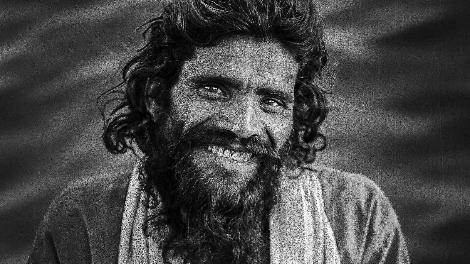 Smiling photo of Sadhu Gyananand on the banks of River Narmada in Madheshwar