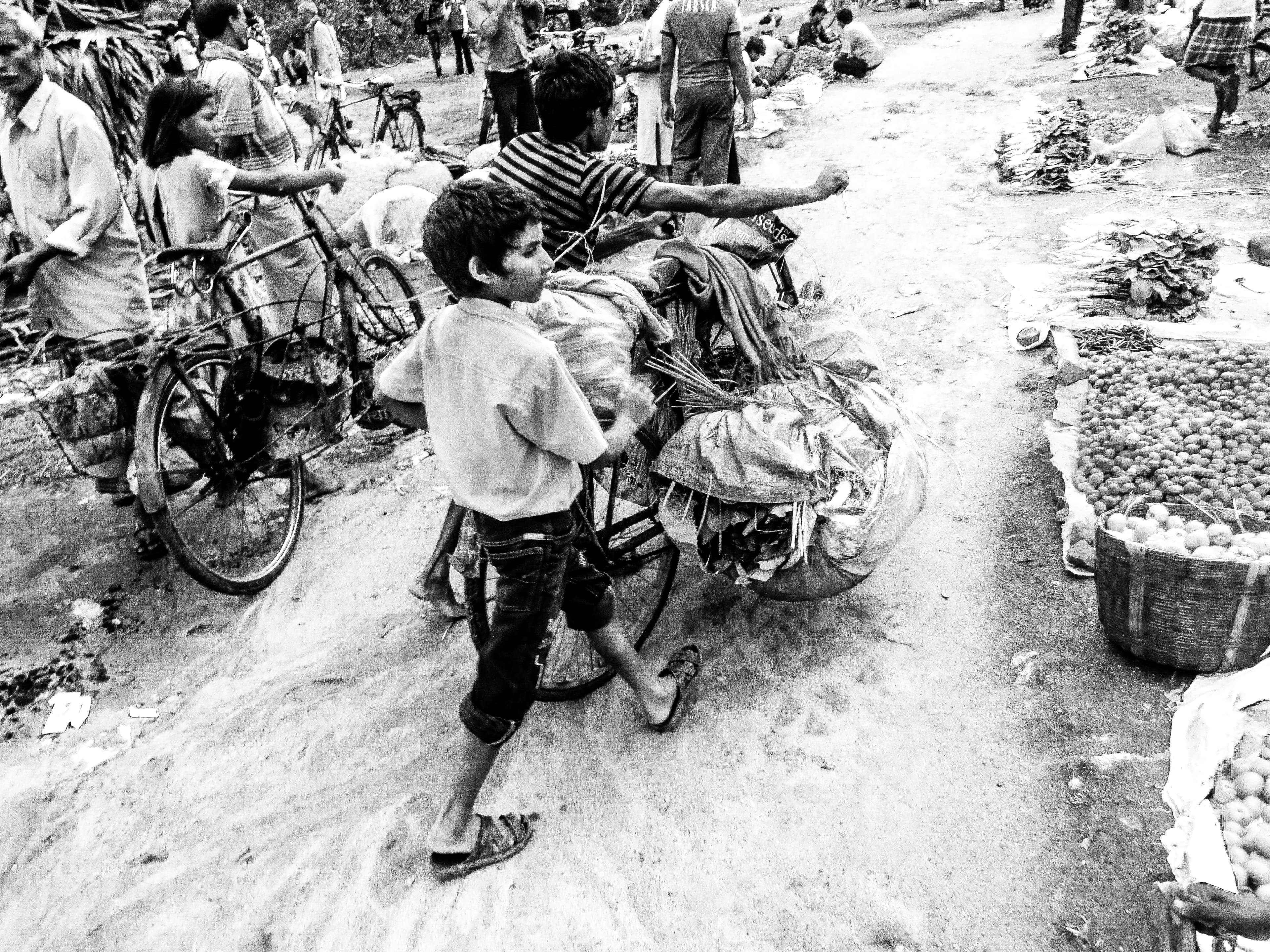 Boy with bicycle in Hatia